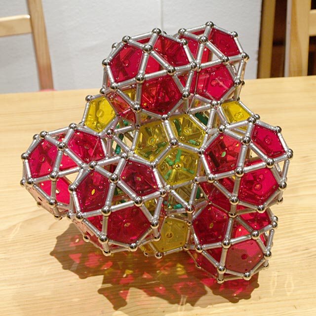 GEOMAG constructions: Twelve icosahedra, eight dodecahedra, and twelve icosidodecahedra around a rhombicosidodecahedron (incomplete)